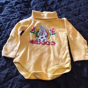 Yellow Mexico Kids Bodysuit featuring the logo of the Club América soccer team